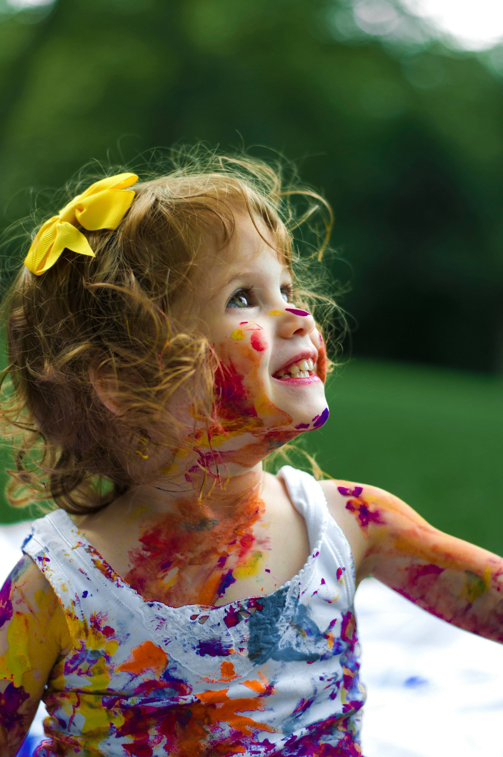 Laughing girl with paint on her face